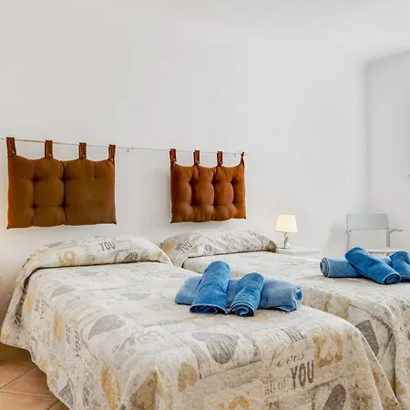 Apartment Guesthost - Migliarina Bedrooms